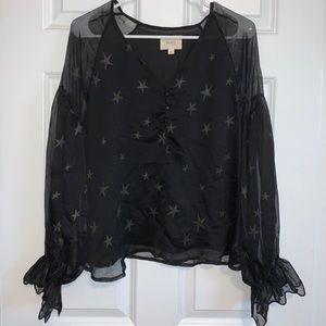 Size M long sleeve black blouse with stars.